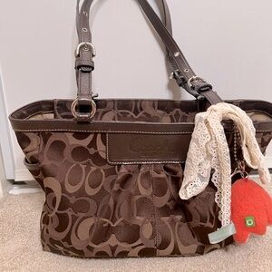 Coach shoulder back dark brown leather straps with ribbon & animal keychain